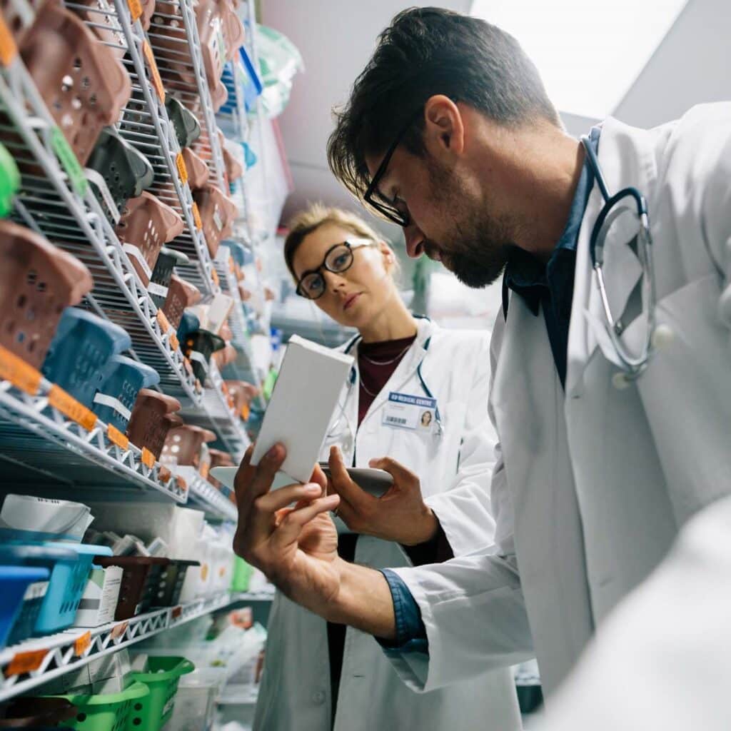 Two hospitals pharmacists reviewing medicines